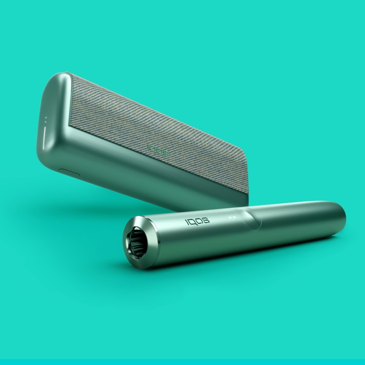 A Jade Green IQOS ILUMA PRIME Holder and Pocket Charger.