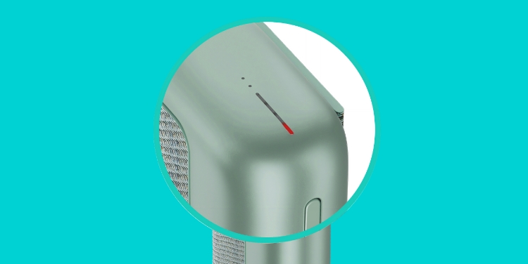 A close-up of a red light on IQOS ILUMA PRIME Pocket Charger.
