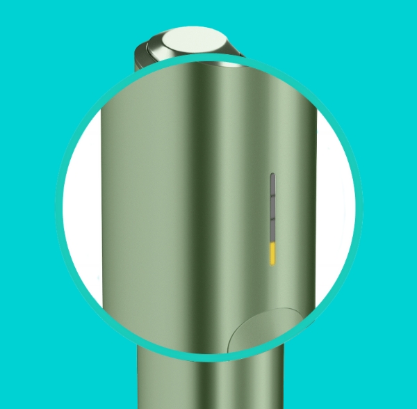 A close-up of one yellow light on IQOS ILUMA ONE device