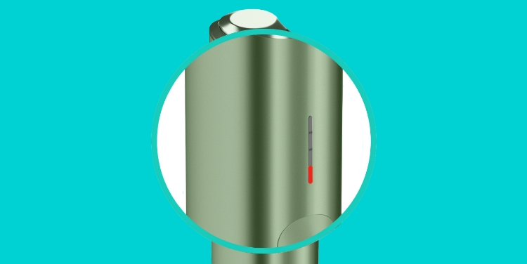 A close-up of one red light on IQOS ILUMA ONE device