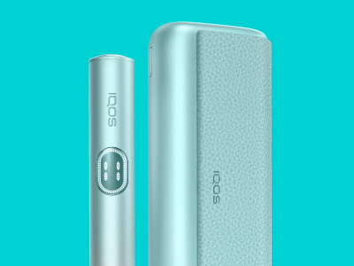 Blue IQOS ILUMA i PRIME device standing near its charger