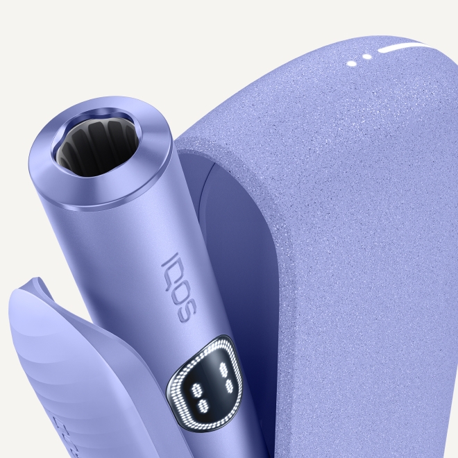 Violet IQOS ILUMA i device inside its opened charger - detail