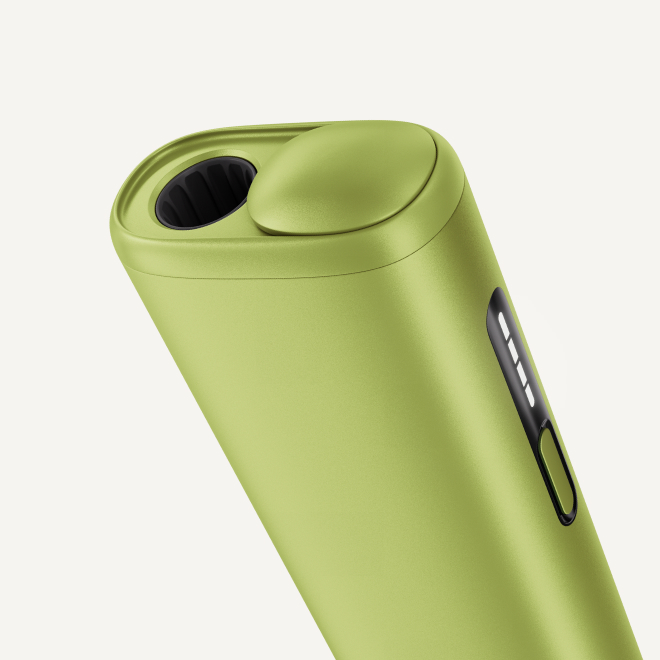Green IQOS ILUMA i ONE device, detail view from above