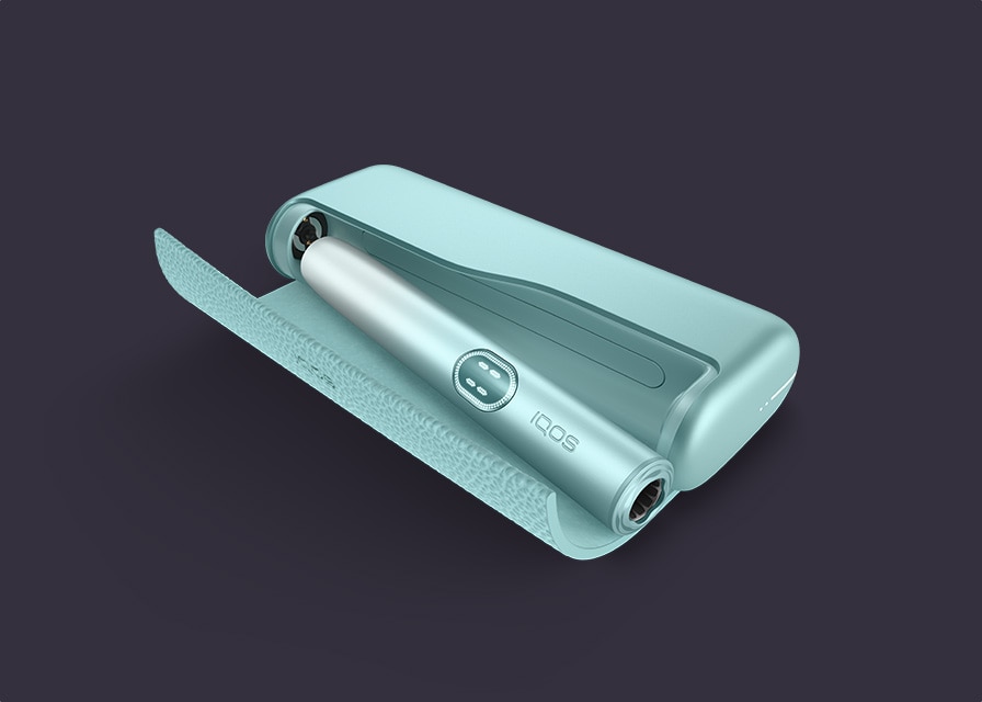 Breeze Blue IQOS ILUMA i PRIME device inside its charger, on a black background